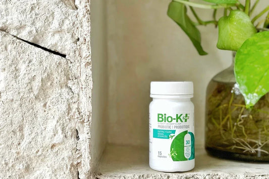  A traveller packing a Bio-K+ probiotic bottle alongside their belongings before a trip